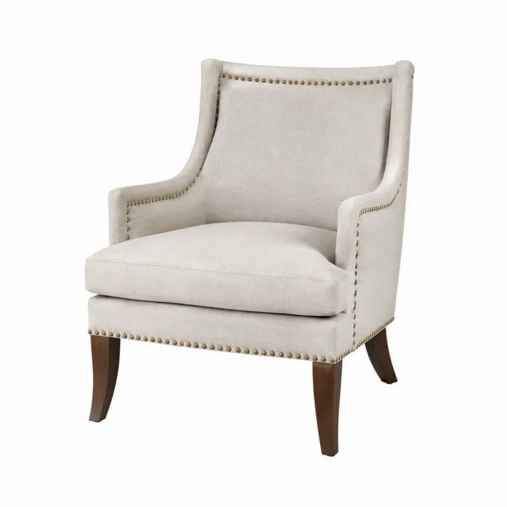 sillón butaca tapizada en tejido poliéster beige con estructura de madera de caucho y tachuelas decorativas 78 cm ancho 82 cm profundidad 88 cm alto