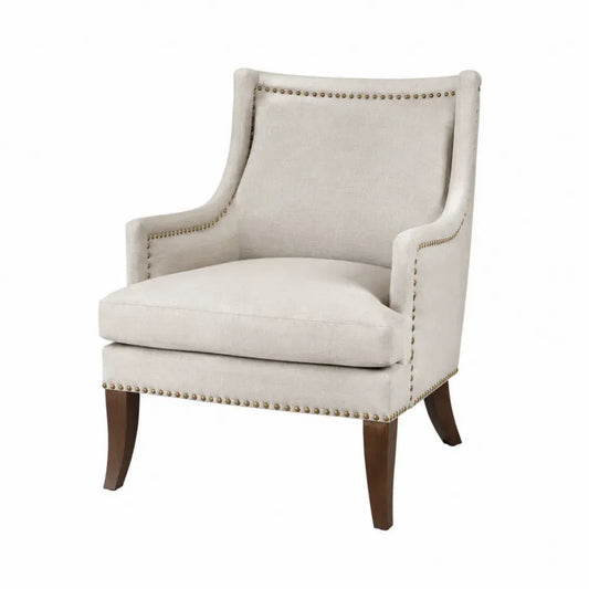 sillón butaca tapizada en tejido poliéster beige con estructura de madera de caucho y tachuelas decorativas 78 cm ancho 82 cm profundidad 88 cm alto